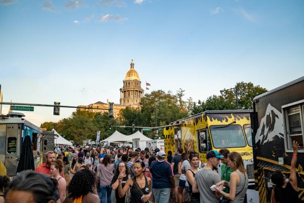 Taste of Colorado attendees browse the food truck offerings at the annual culinary tradition in 2019.