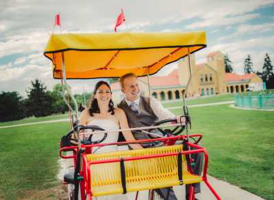 Bride and Groom Riding a Golf Cart in a City Park Wedding in Denver, Colorado